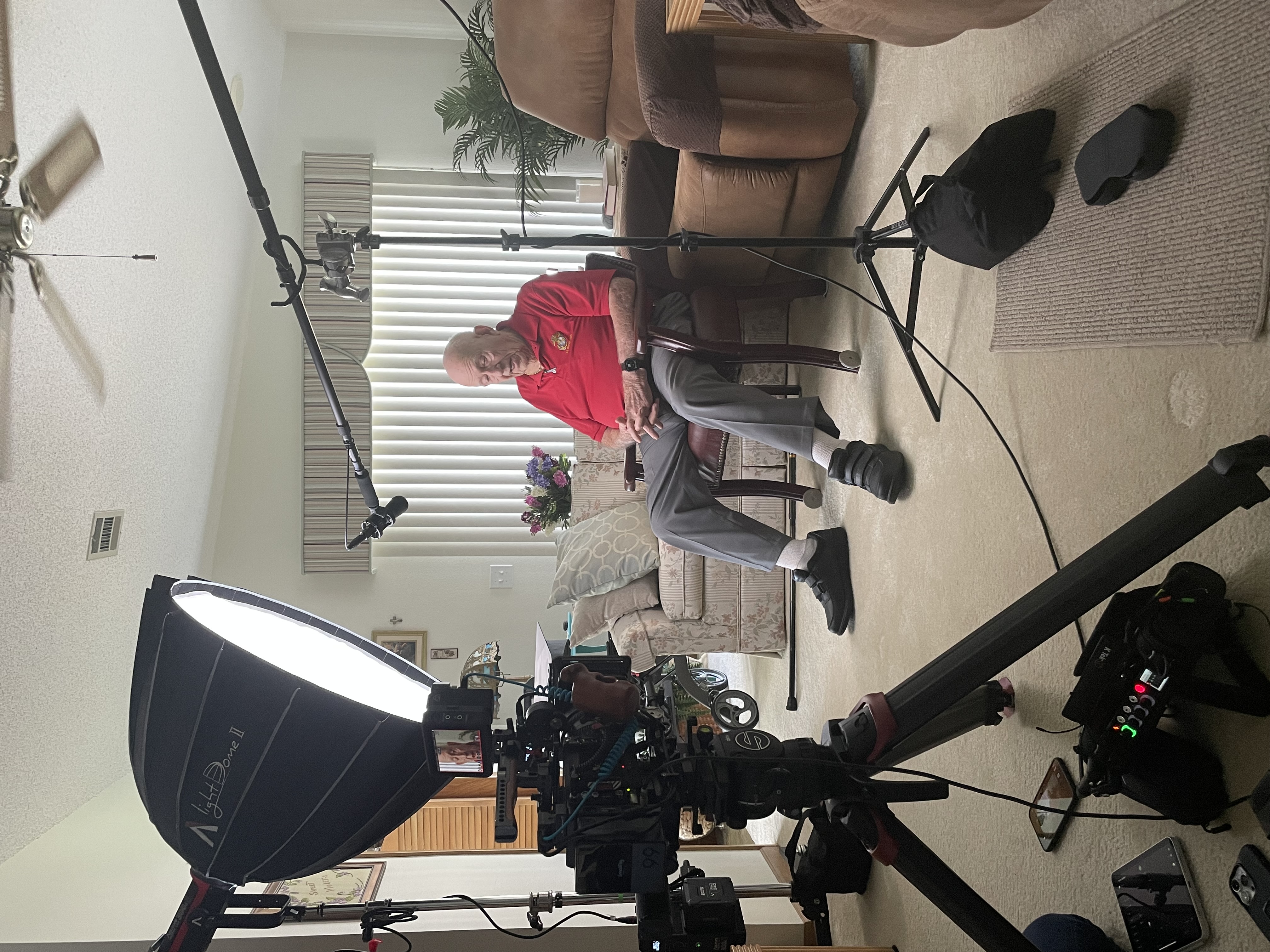 Elmer sits in front of the camera before the interview